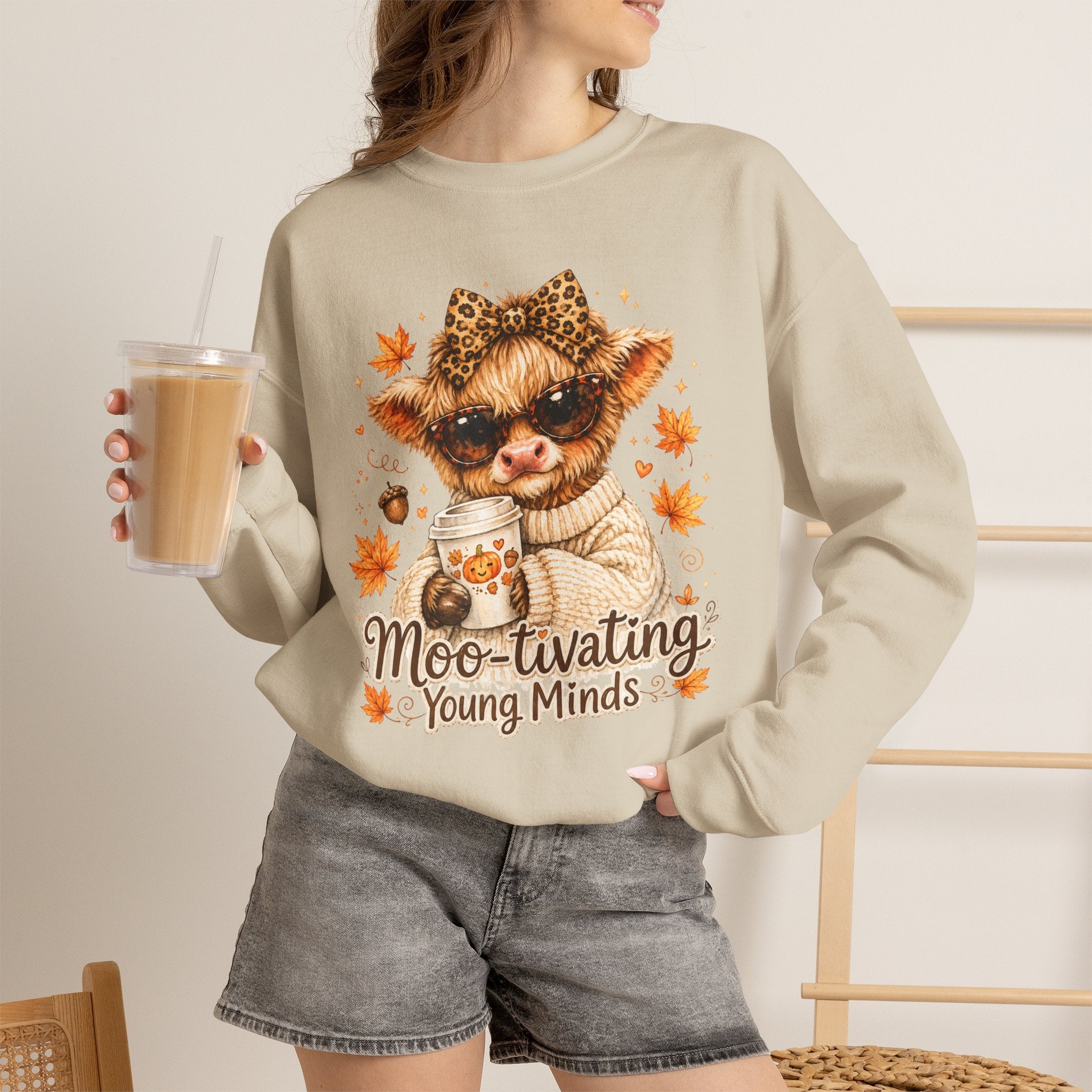 Moo-tivating Young Minds Sweatshirt | Cute Highland Cow Teacher Crewneck